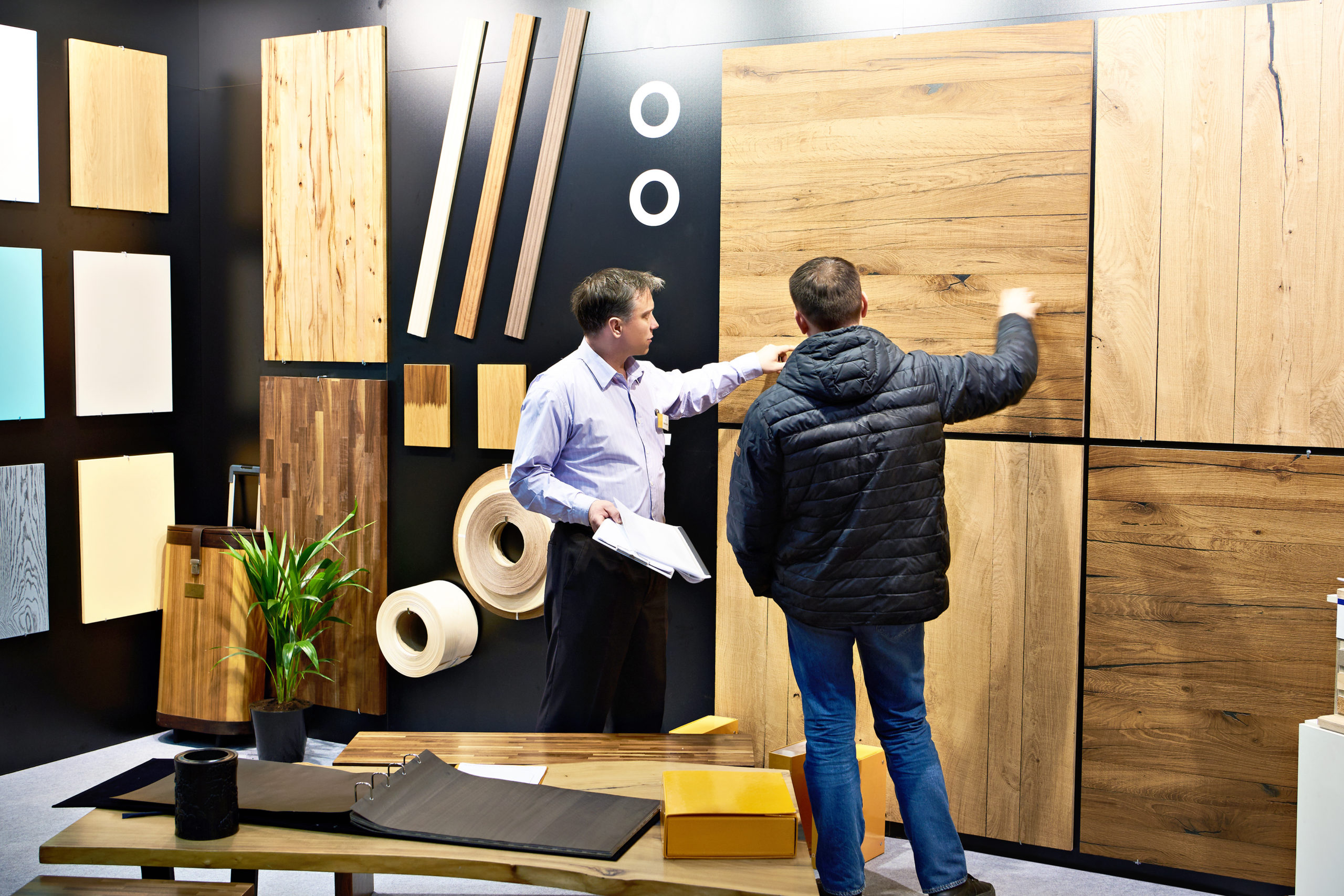 Men in shop of wooden panels